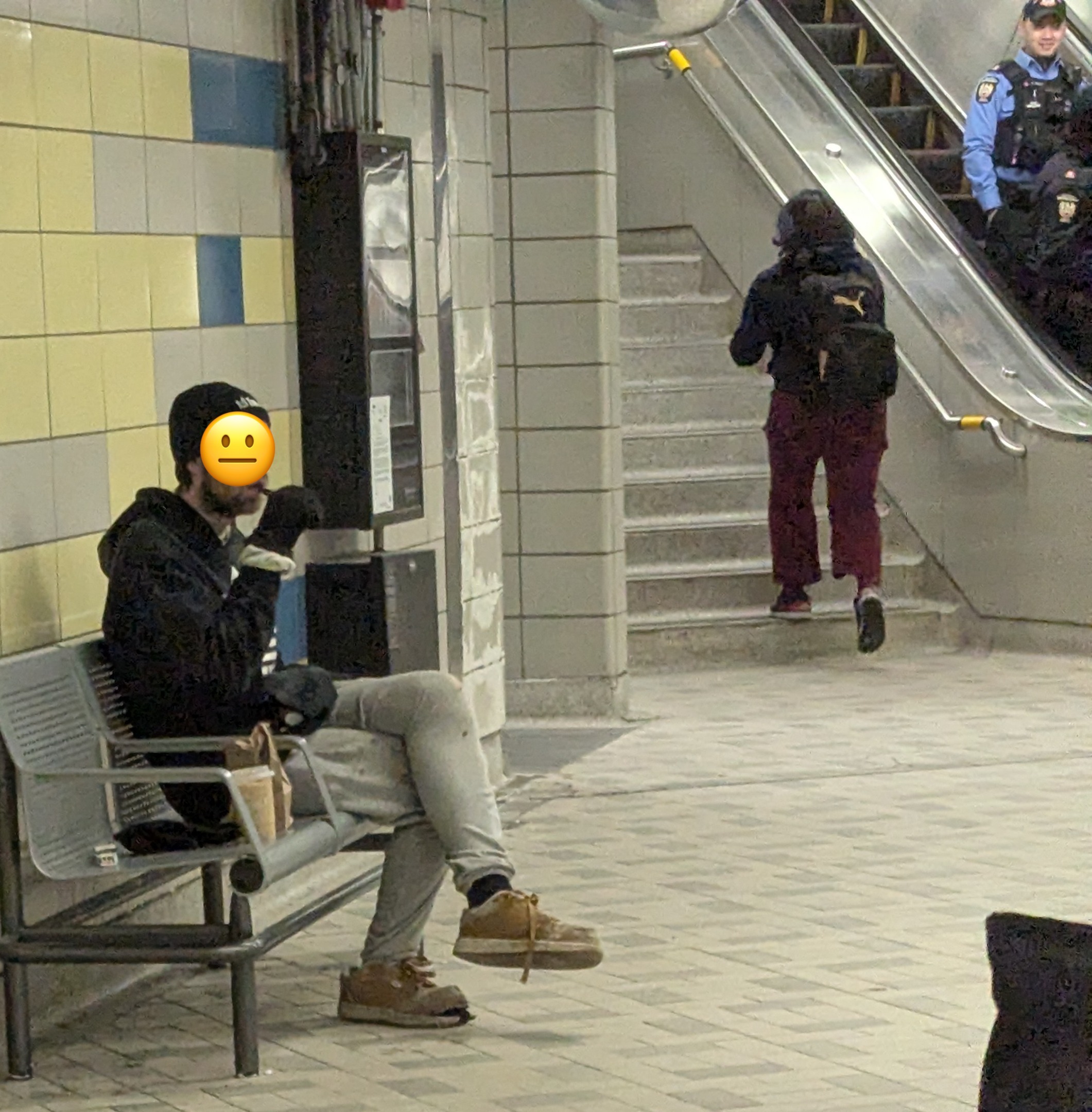Man vaping indoors, inside of a TTC station.